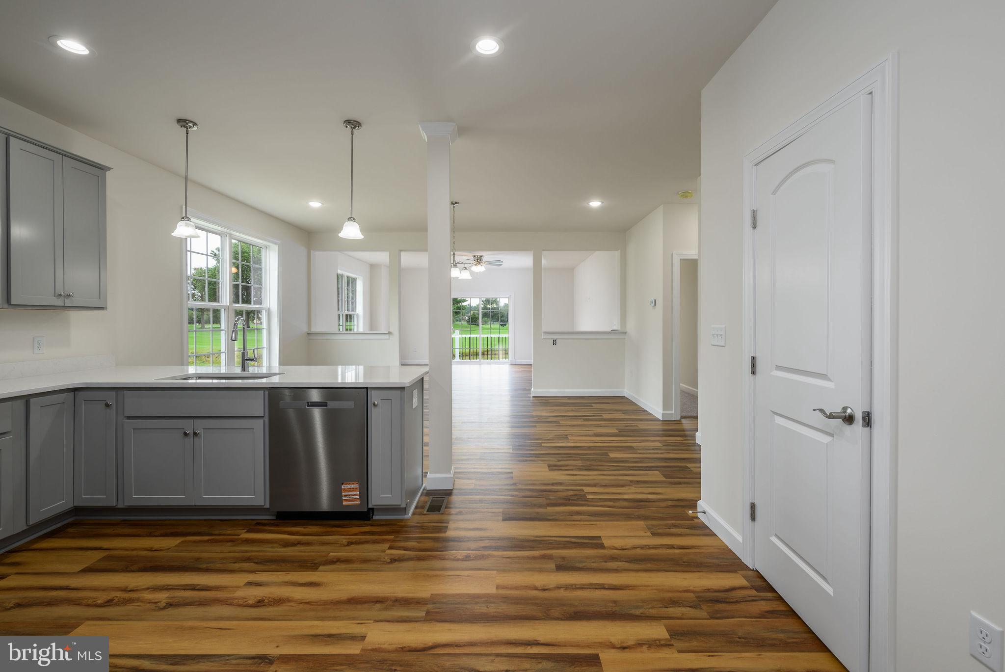 3 Valhalla Court Dover, DE 19904 - Photo 19 of 57 a view of a kitchen with wooden floor and a window