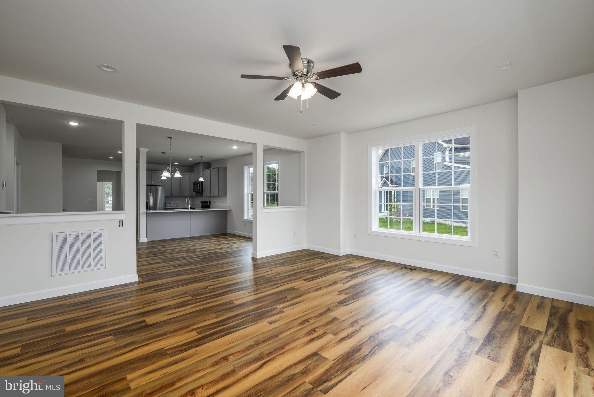 3 Valhalla Court Dover, DE 19904 - Photo 26 of 57 a view of empty room with wooden floor and fan