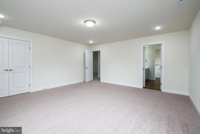 a view of a lake with houses in the background