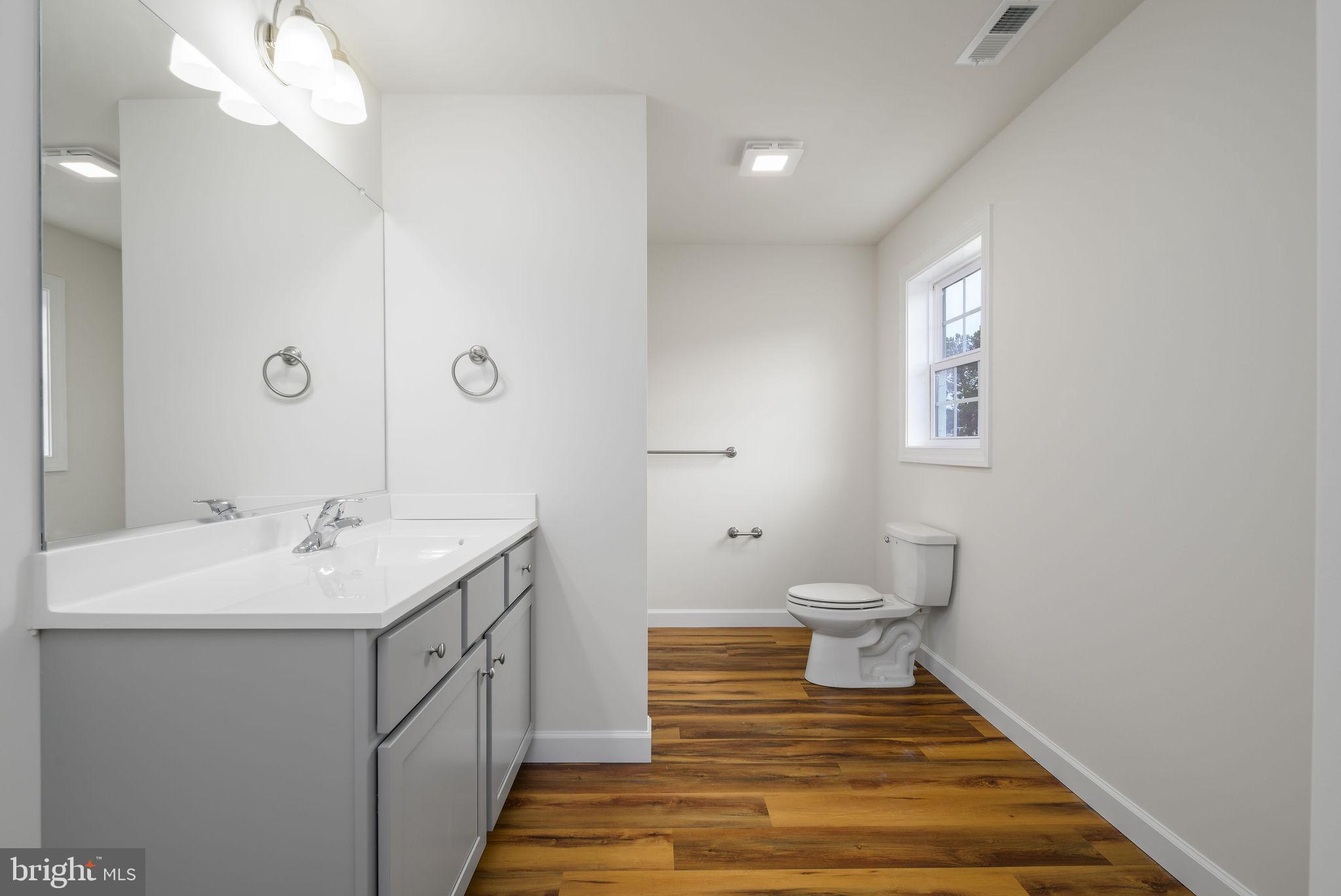 3 Valhalla Court Dover, DE 19904 - Photo 48 of 57 a bathroom with a sink and a mirror