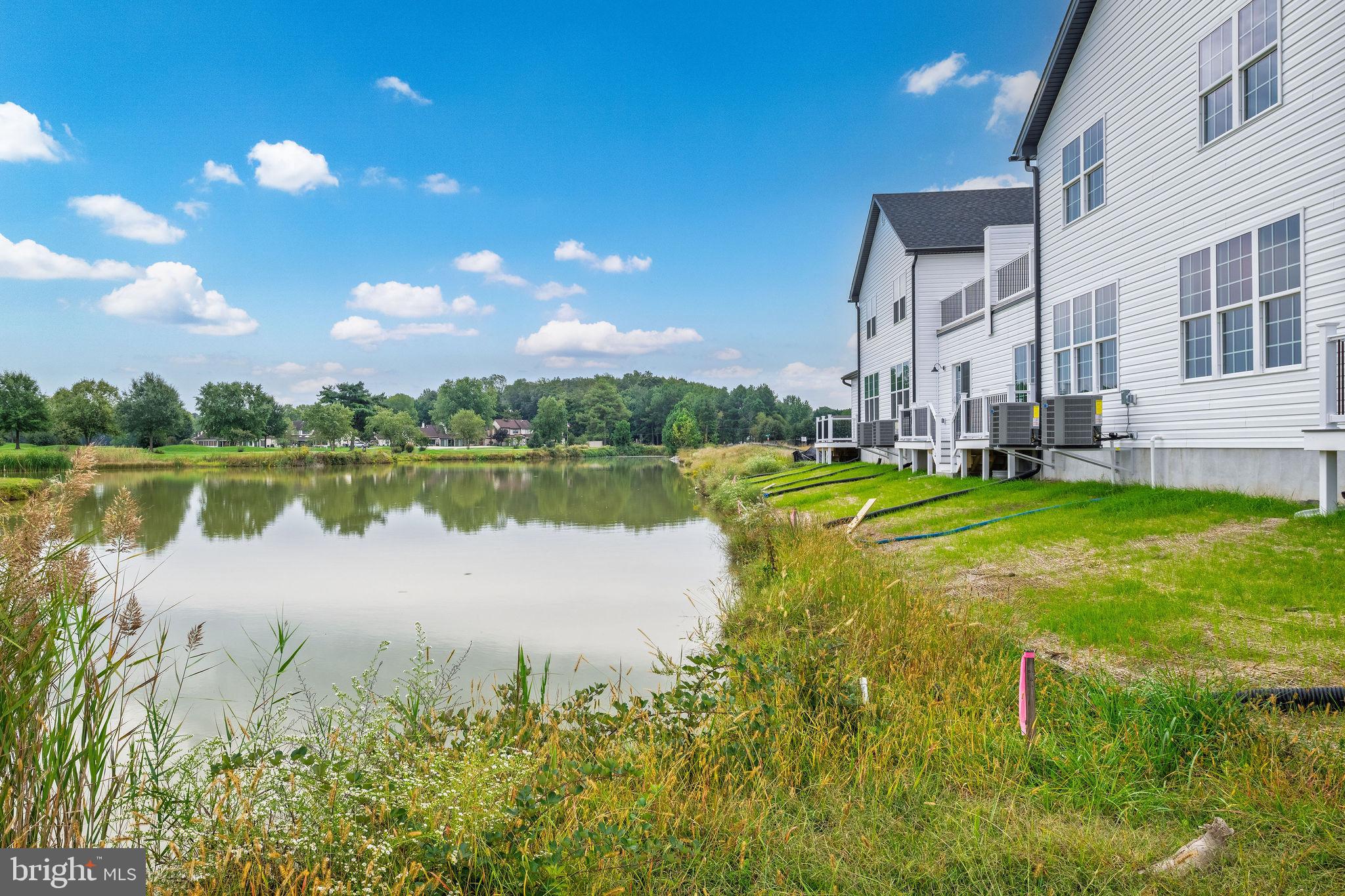 3 Valhalla Court Dover, DE 19904 - Photo 52 of 57 a view of a lake with houses in the background