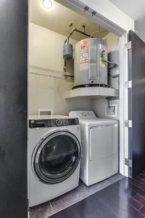 a room with wooden floor and windows