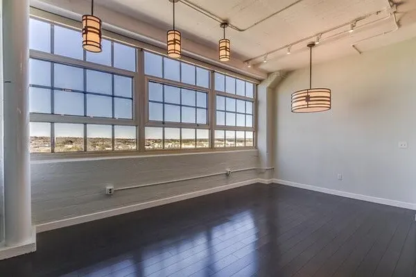 a media room with lots of chairs and a projector screen