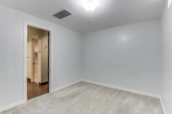 a kitchen that has a sink and a stove top oven