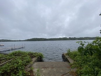 21 1/2 West Sutton Road Sutton, MA 01590 - Photo 1 of 12 a view of a lake from a yard