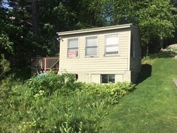 21 1/2 West Sutton Road Sutton, MA 01590 - Photo 7 of 12 a view of a house with a yard
