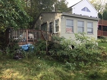 21 1/2 West Sutton Road Sutton, MA 01590 - Photo 8 of 12 a backyard of a house with plants and tree