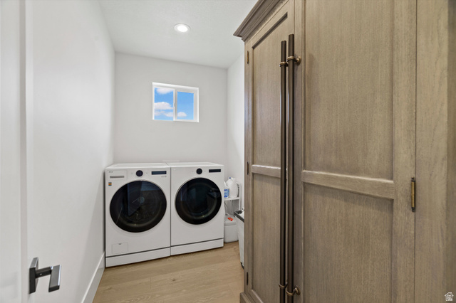 3349 Oxford Loop Morgan, UT 84050 - Photo 15 of 47 Laundry room featuring light wood finished floors, washing machine and dryer, and recessed lighting