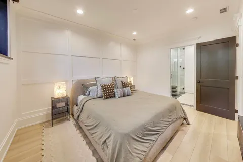 a bedroom with a bed and a walk in closet