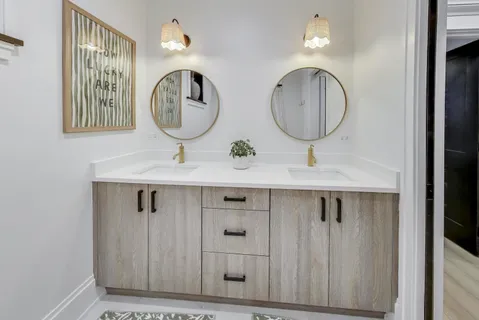 a bathroom with mirror a sink and a mirror