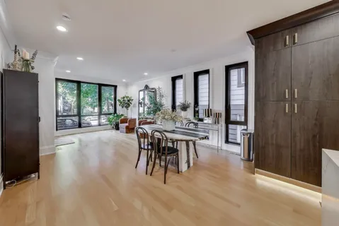 a view of a a dining room with furniture window and outside view