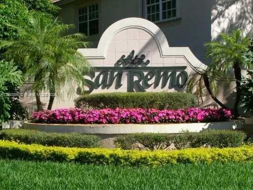 a view of a house with a big yard and large trees