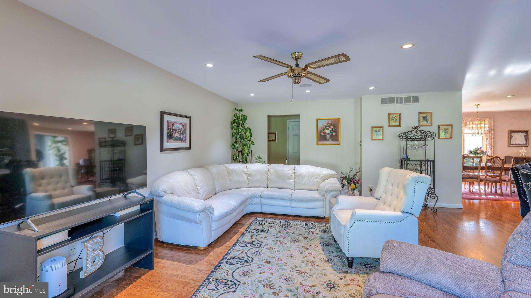 272 Hartford Road Medford, NJ 08055 - Photo 18 of 37 a living room with furniture wooden floor and a view of kitchen