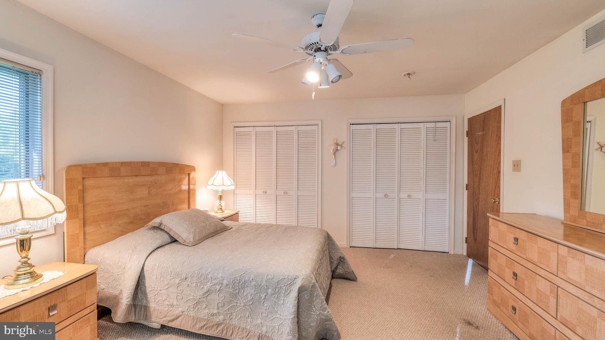 272 Hartford Road Medford, NJ 08055 - Photo 24 of 37 a bedroom with a bed and a chandelier