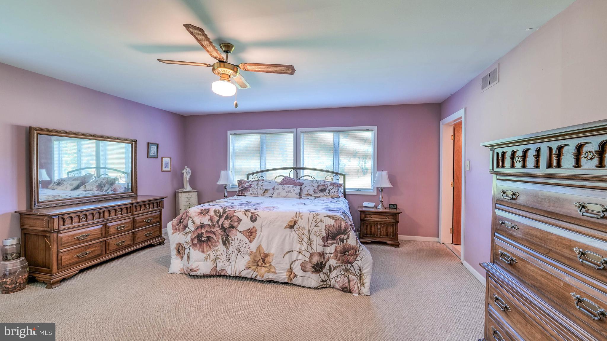 272 Hartford Road Medford, NJ 08055 - Photo 25 of 37 a bedroom with a bed and a chandelier