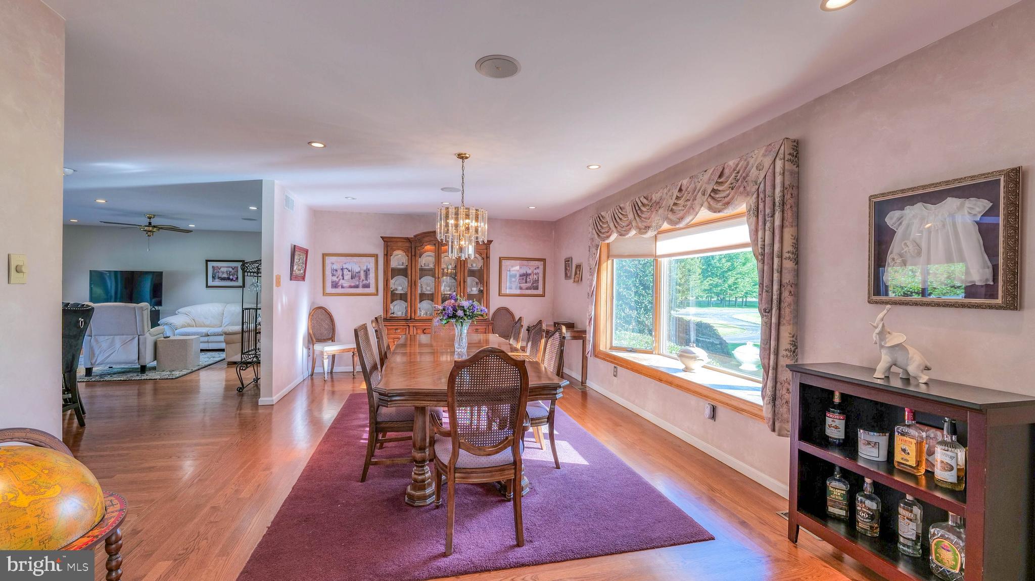 272 Hartford Road Medford, NJ 08055 - Photo 9 of 37 a view of a dining room with furniture and a book shelf