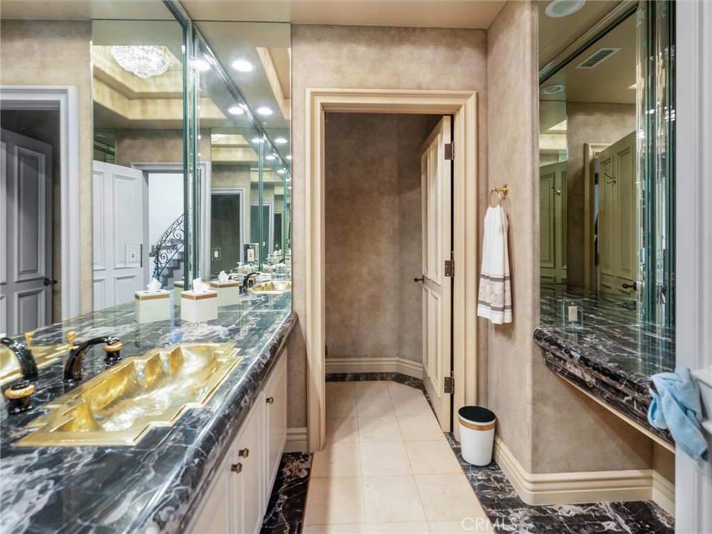 6000 Cavalleri Road Malibu, CA 90265 - Photo 41 of 44 a bathroom with a granite countertop tub sink and mirror