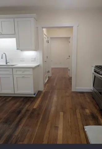 a room with wooden floors and closet