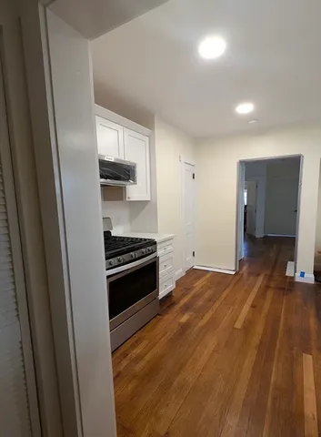 a kitchen with a sink and a stove top oven