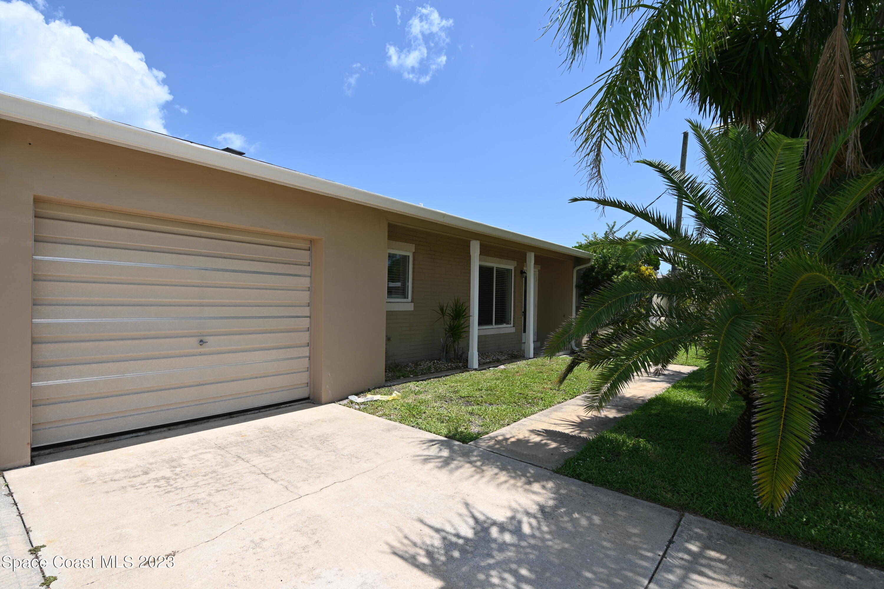 431 Sandpiper Drive Satellite Beach, FL 32937 - Photo 1 of 35 a backyard of a house