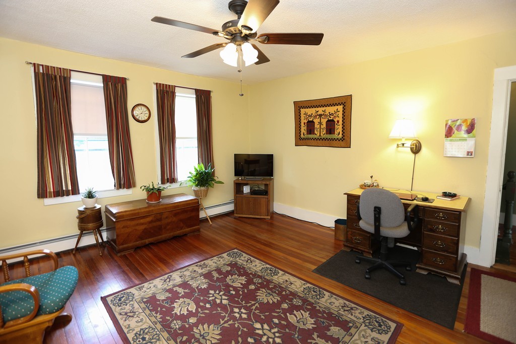 118 Bourne Street Three Rivers, MA 01080 - Photo 11 of 30 a living room with furniture and a flat screen tv