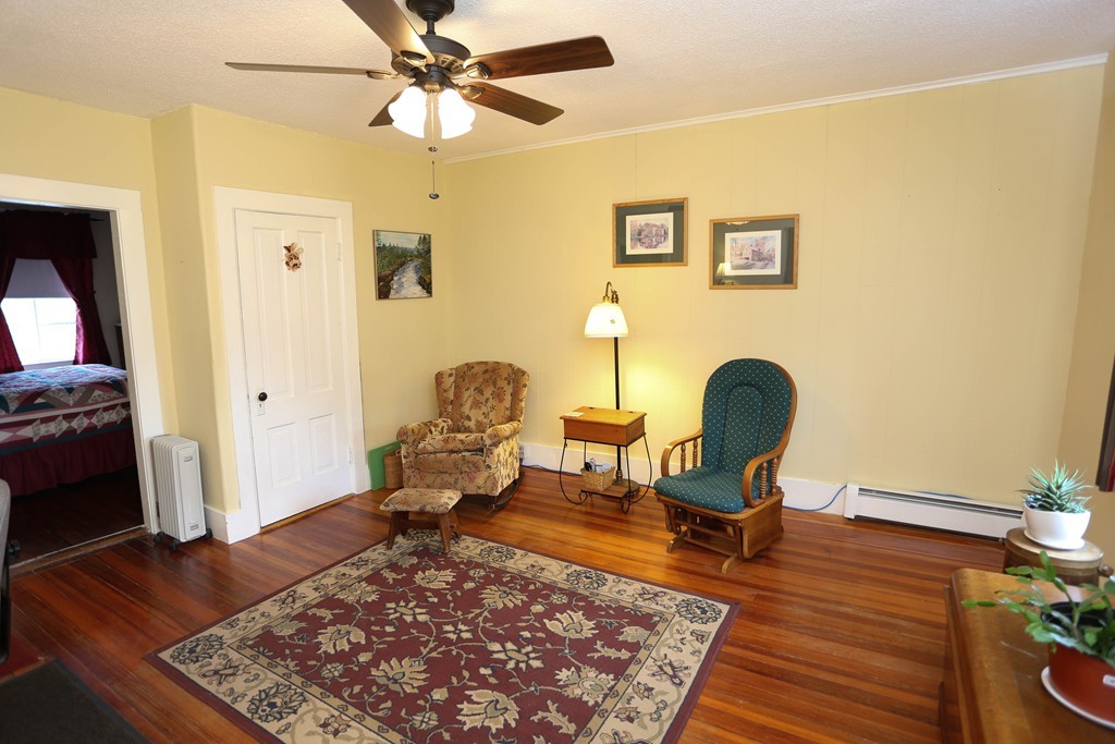 118 Bourne Street Three Rivers, MA 01080 - Photo 12 of 30 a living room with furniture and a rug