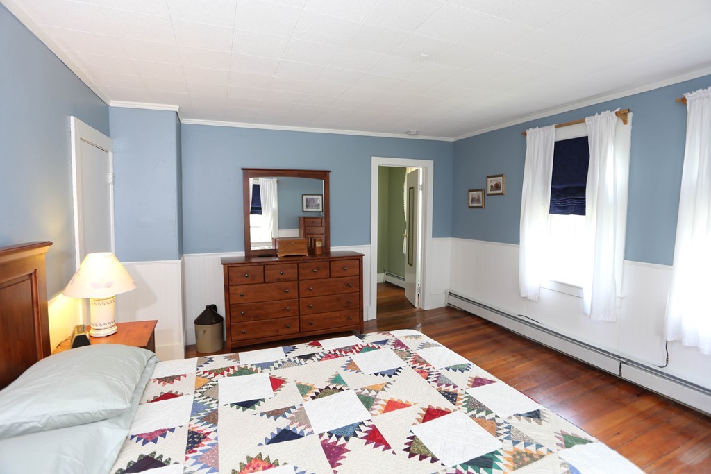 118 Bourne Street Three Rivers, MA 01080 - Photo 15 of 30 a bedroom with a bed and wooden floor