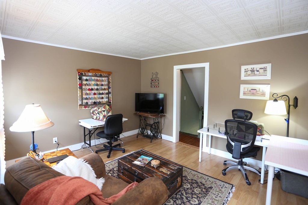 118 Bourne Street Three Rivers, MA 01080 - Photo 18 of 30 a living room with furniture a lamp and a flat screen tv