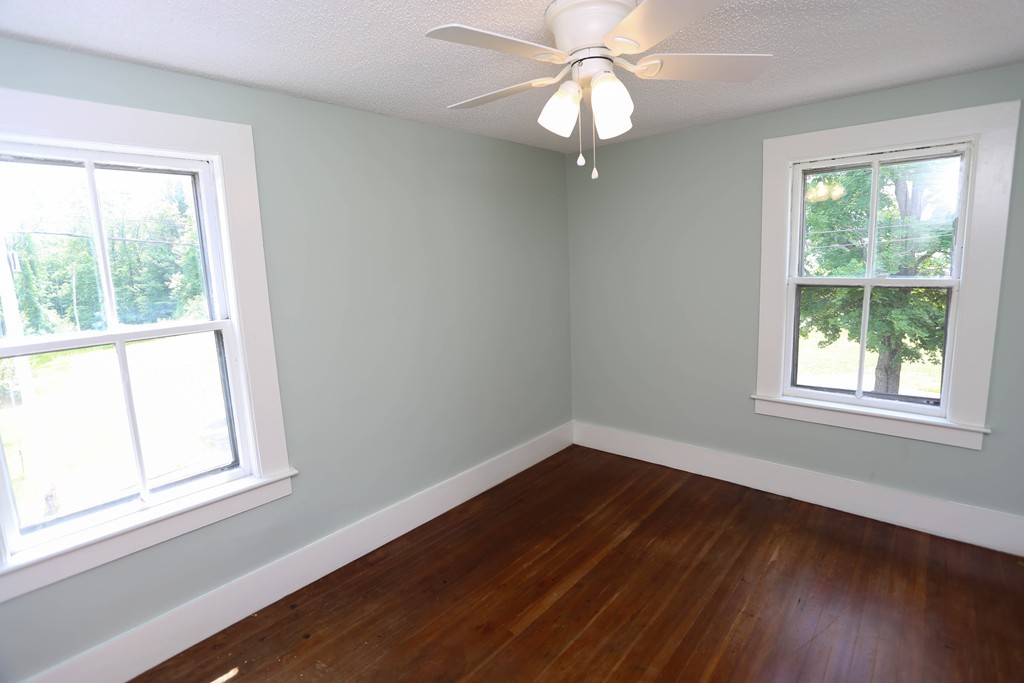 118 Bourne Street Three Rivers, MA 01080 - Photo 26 of 30 a view of an empty room with wooden floor and a window