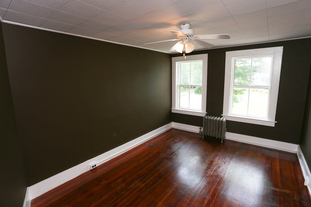 118 Bourne Street Three Rivers, MA 01080 - Photo 28 of 30 a view of an empty room with wooden floor and a window