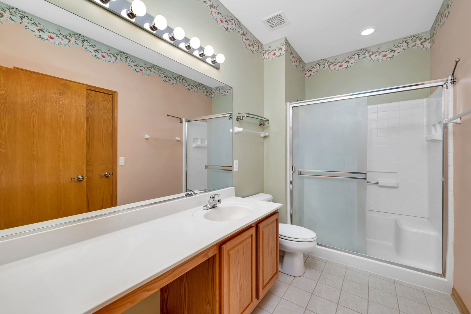 1592 Cadillac Circle Romeoville, IL 60446 - Photo 18 of 25 a bathroom with a double vanity sink mirror and toilet