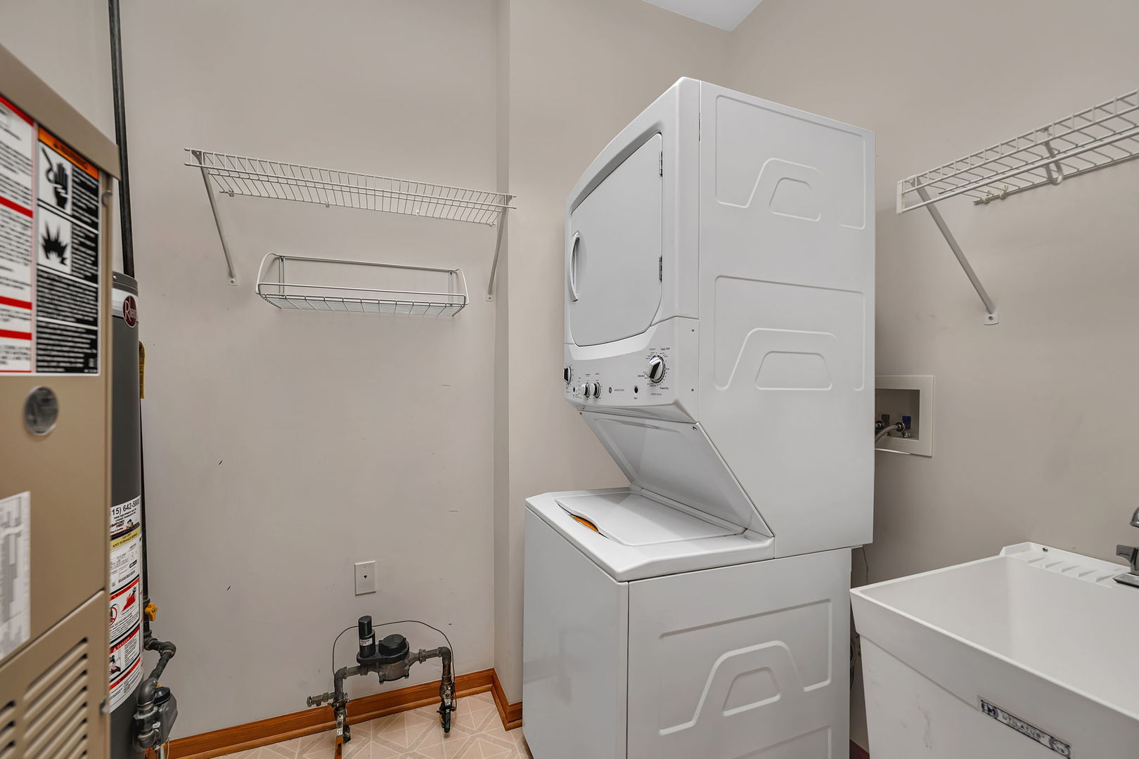 1592 Cadillac Circle Romeoville, IL 60446 - Photo 20 of 25 a utility room with dryer and washer