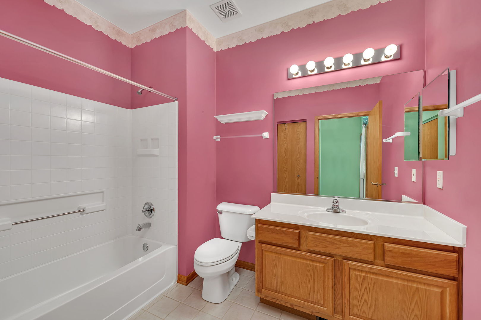 1592 Cadillac Circle Romeoville, IL 60446 - Photo 6 of 25 a bathroom with a bathtub shower sink vanity and toilet