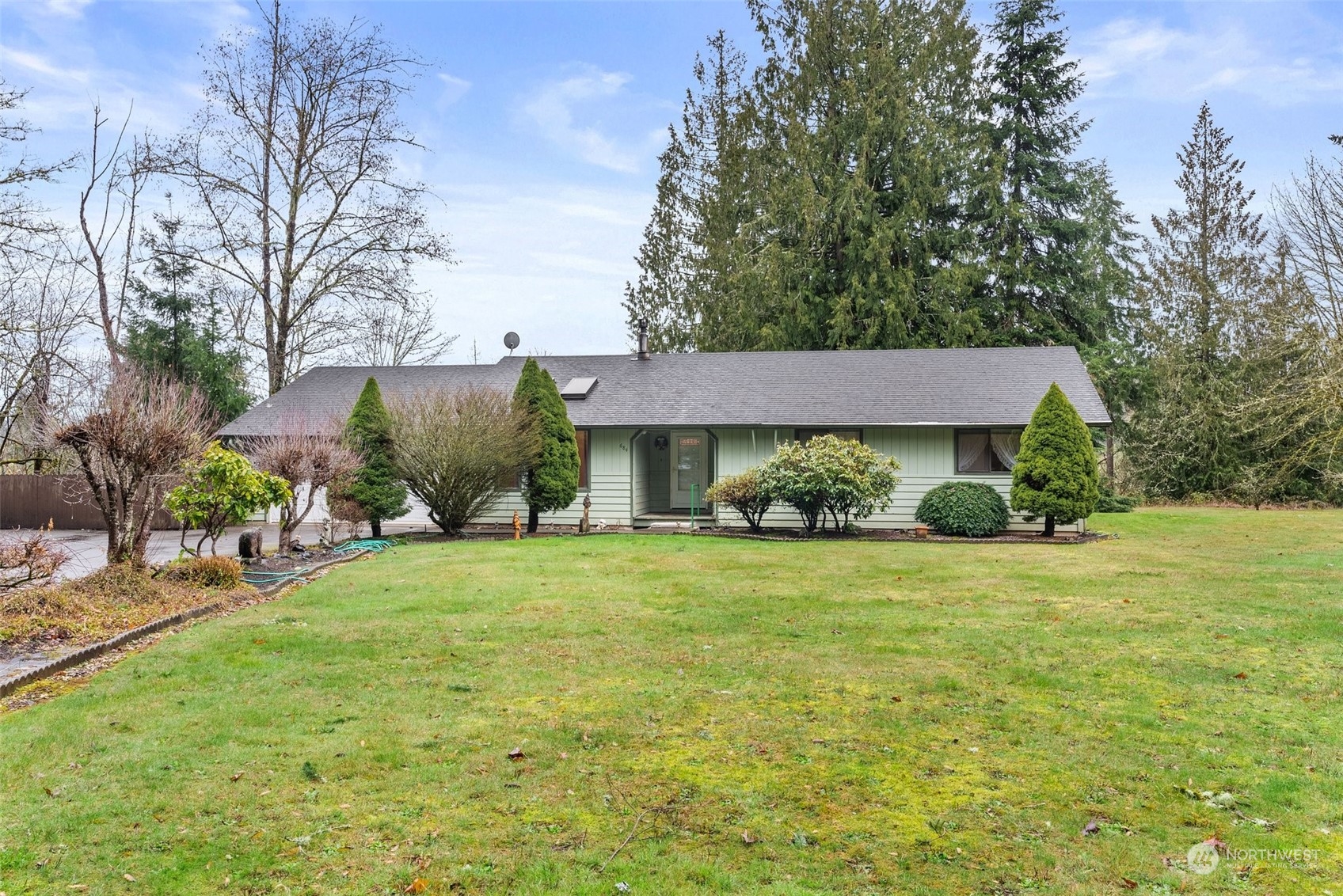 684 Nevil Road Winlock, WA 98596 - Photo 1 of 26 a front view of a house with garden