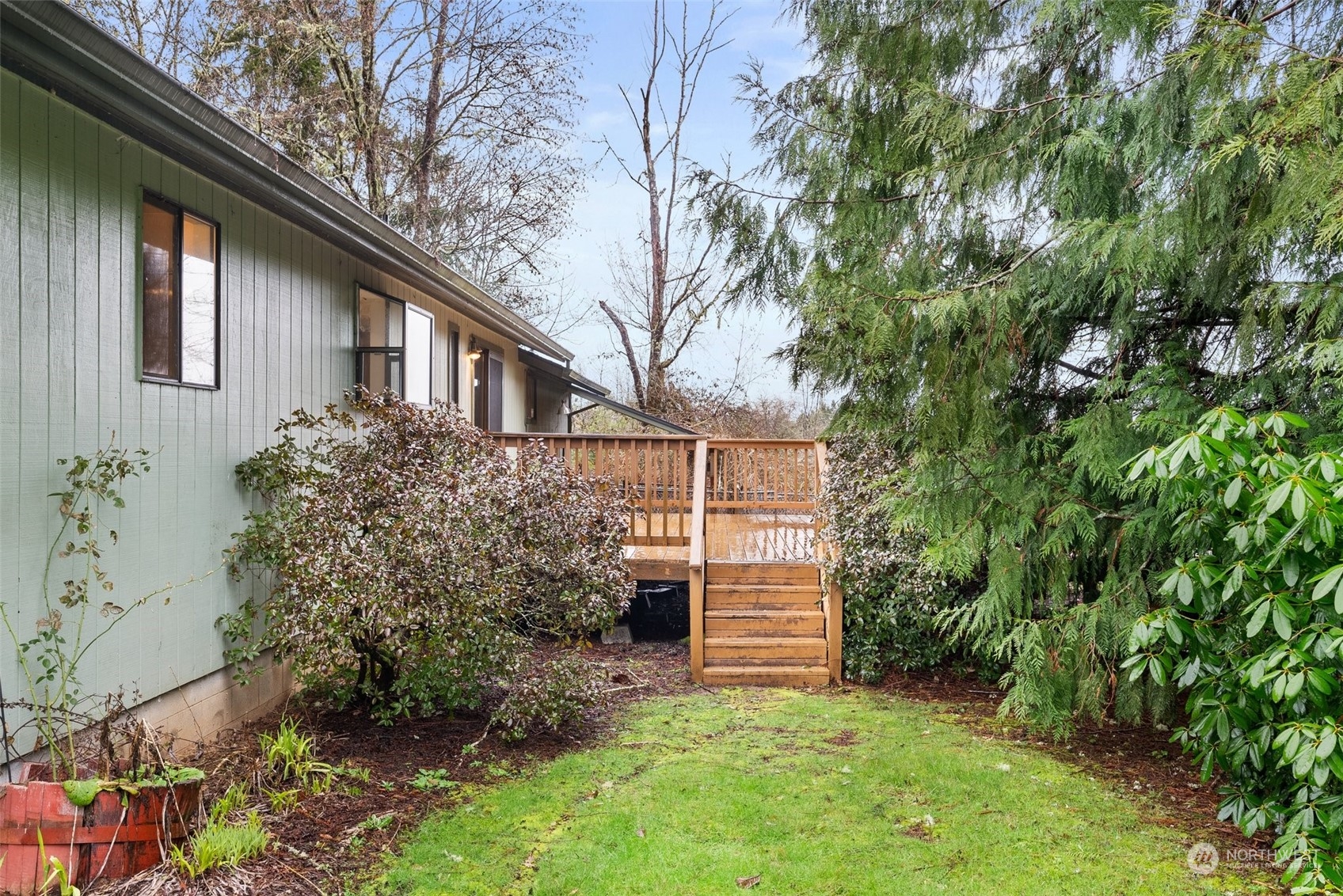 684 Nevil Road Winlock, WA 98596 - Photo 22 of 26 a view of a house with a yard