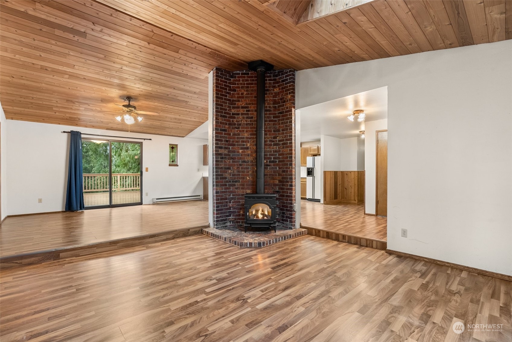 684 Nevil Road Winlock, WA 98596 - Photo 7 of 26 an empty room with wooden floor and windows