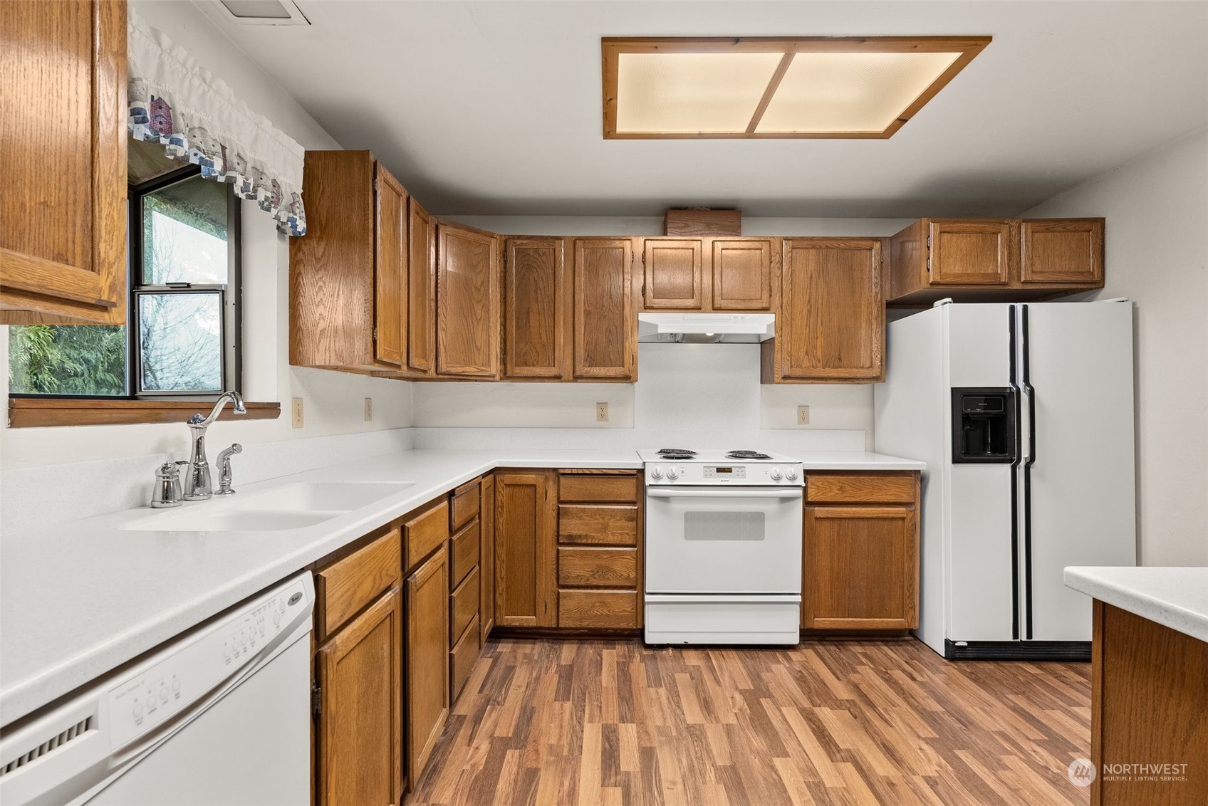 684 Nevil Road Winlock, WA 98596 - Photo 10 of 26 a kitchen with white cabinets and white appliances