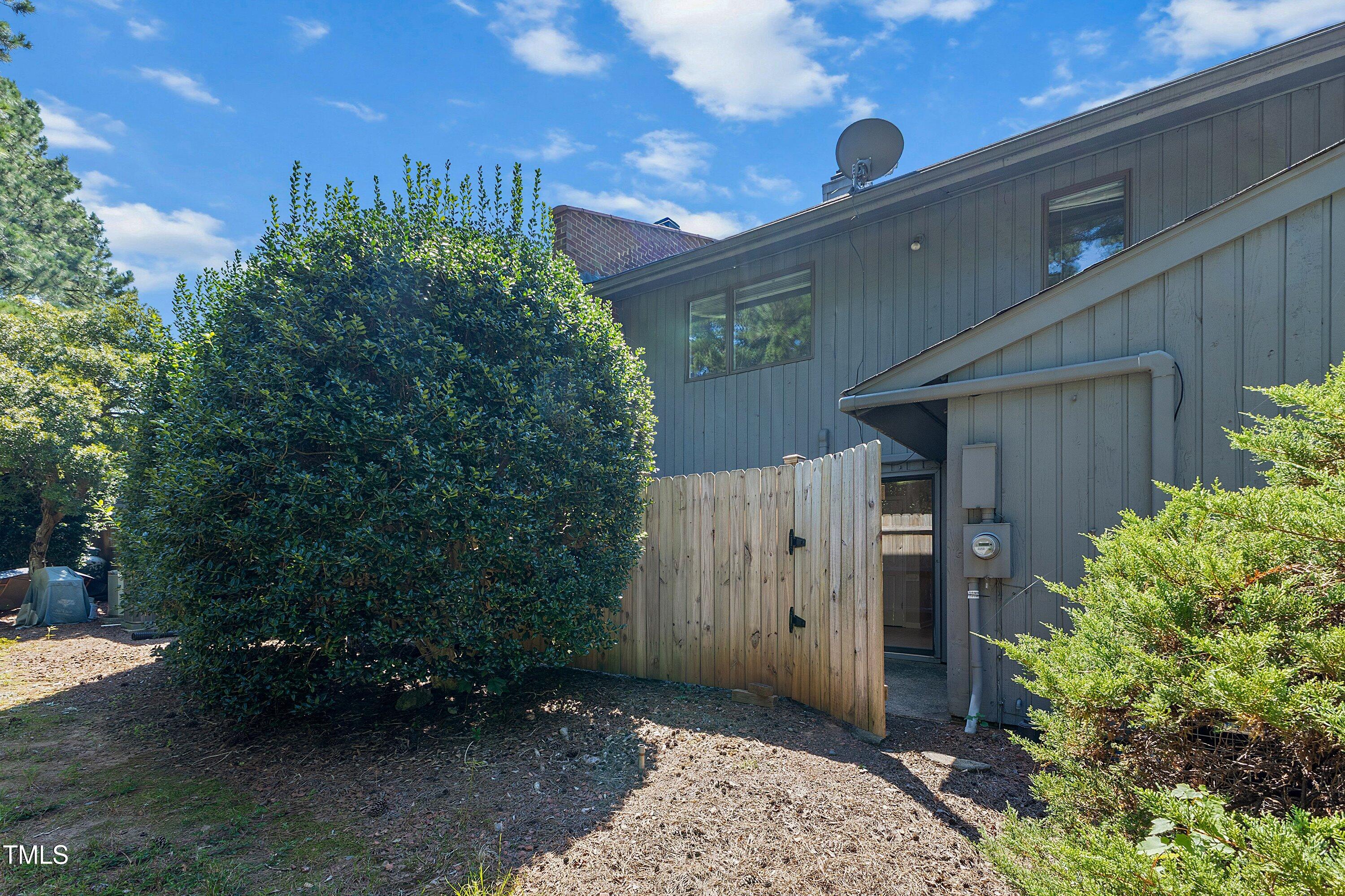 4350 Hunters Club Drive Raleigh, NC 27606 - Photo 26 of 33 a backyard of a house with lots of green space