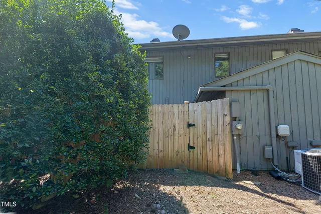 a view of a wooden door and a yard