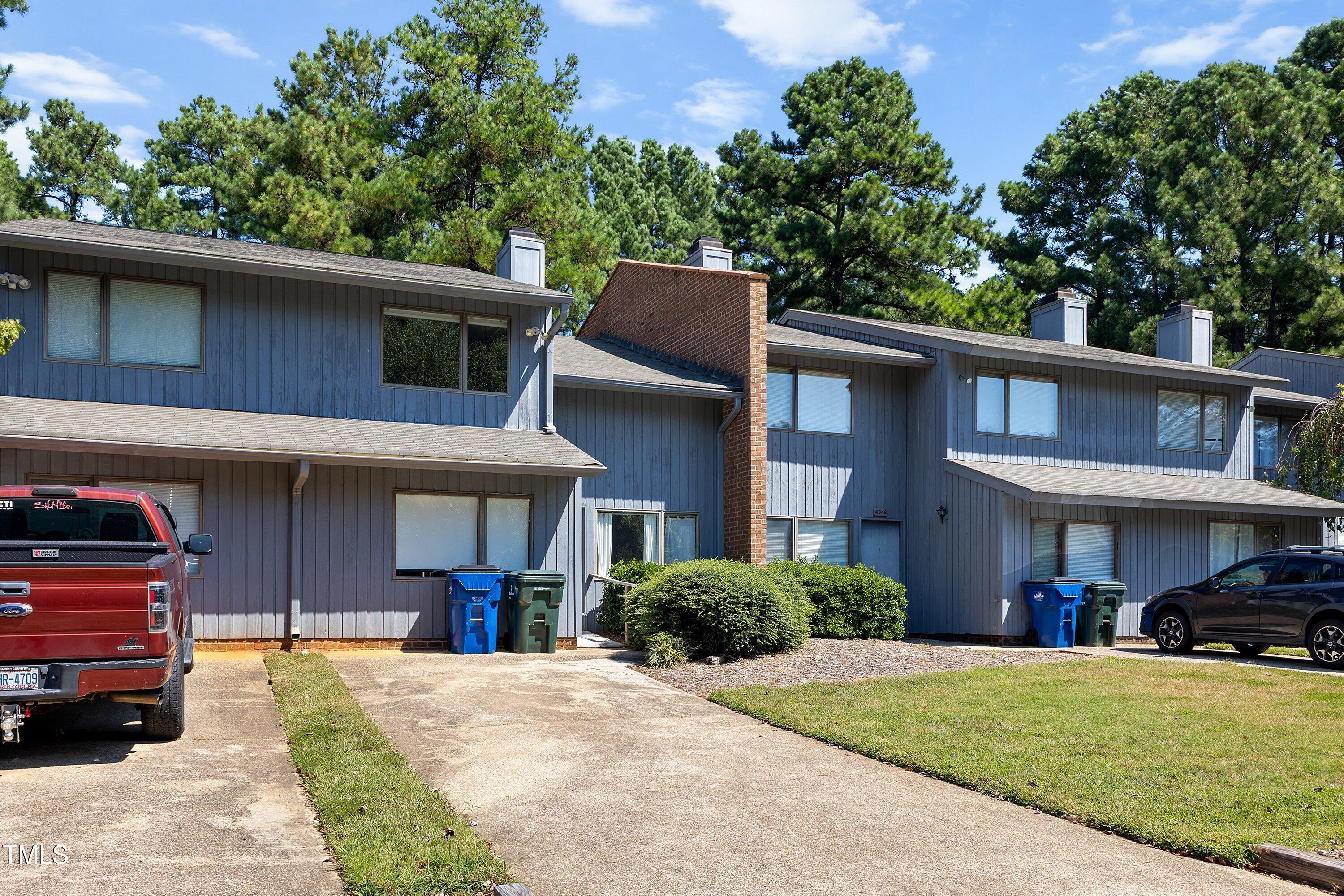 4350 Hunters Club Drive Raleigh, NC 27606 - Photo 29 of 33 a front view of a house with a yard