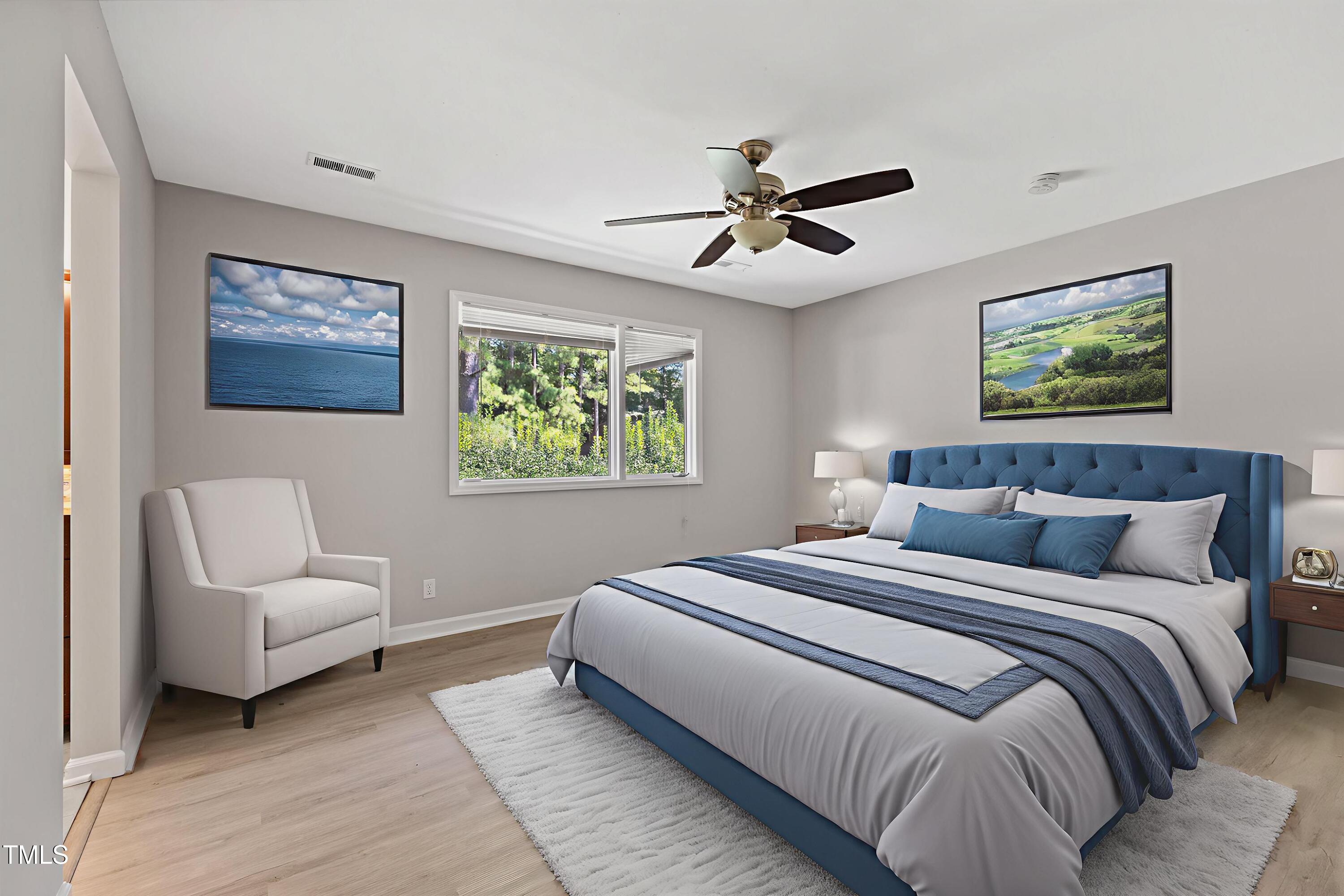 4350 Hunters Club Drive Raleigh, NC 27606 - Photo 3 of 33 a bedroom with bed and a chandelier