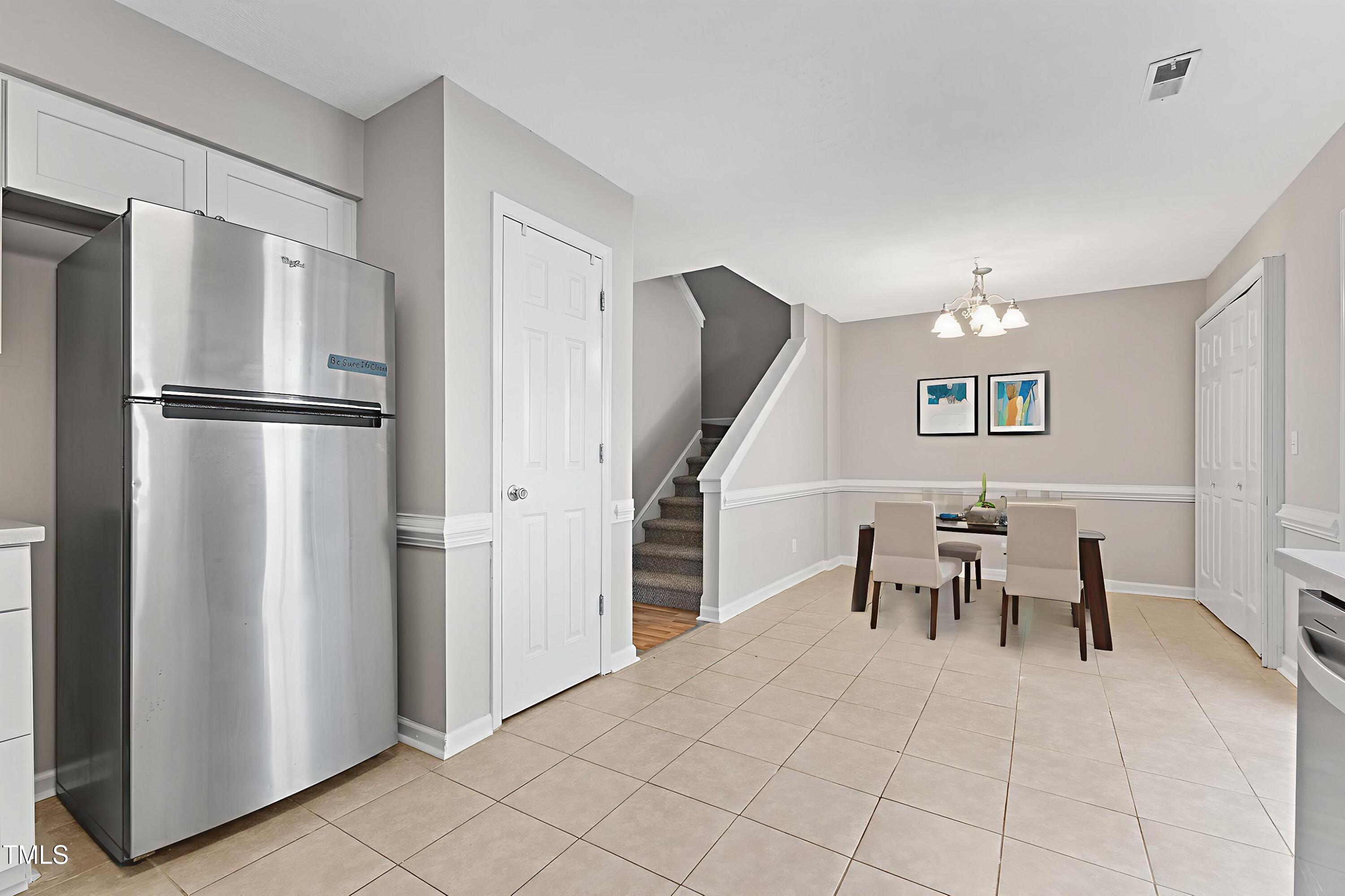 4350 Hunters Club Drive Raleigh, NC 27606 - Photo 4 of 33 a kitchen with stainless steel appliances granite countertop a refrigerator and a stove top oven