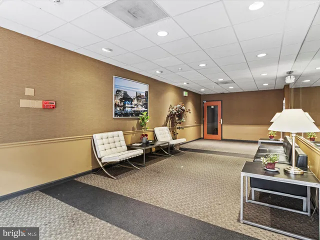 a view of a room with furniture and a window