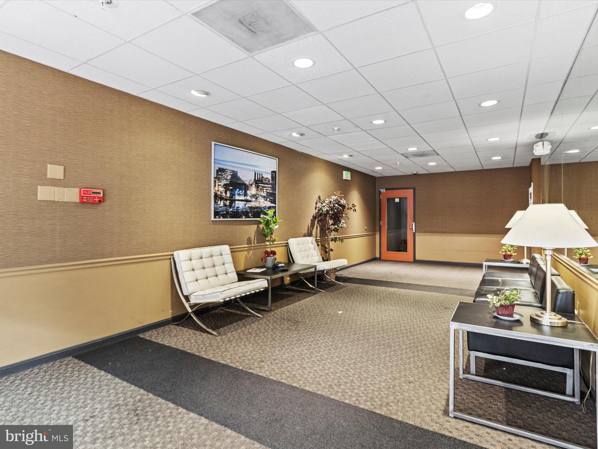 911 South Charles Street, Unit 409 Baltimore, MD 21230 - Photo 15 of 16 a living room with furniture and a flat screen tv