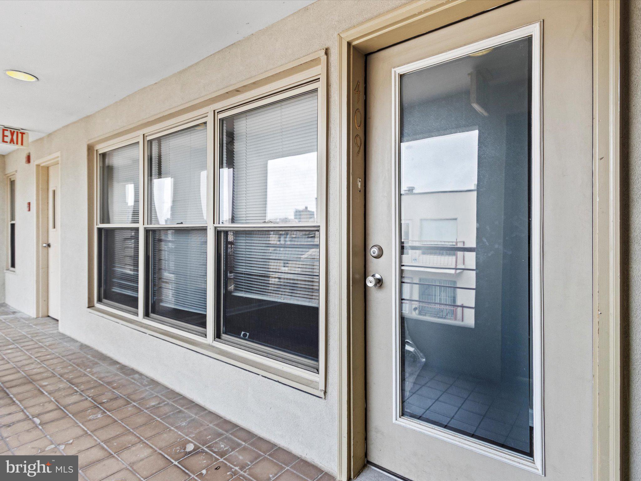 911 South Charles Street, Unit 409 Baltimore, MD 21230 - Photo 2 of 16 a view of a glass door with a glass door
