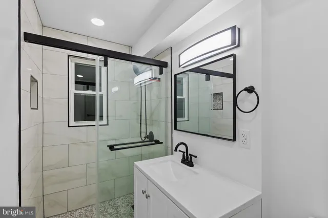 a bathroom with a sink and mirror