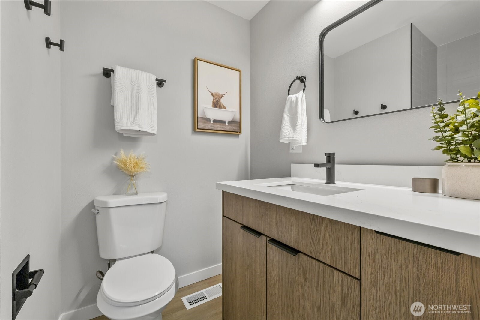 16531 120th Avenue Southeast Renton, WA 98058 - Photo 14 of 25 a bathroom with a toilet sink and mirror