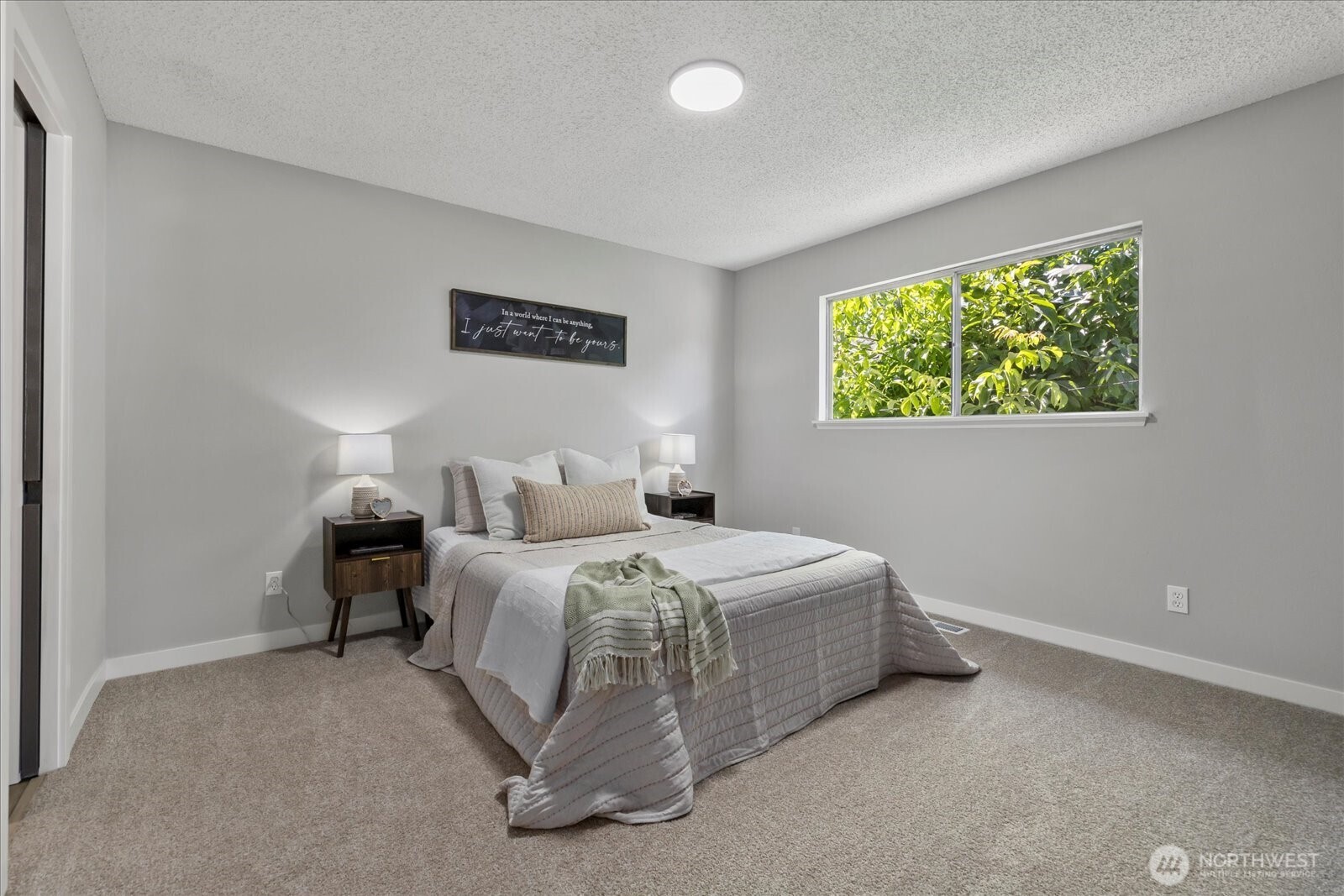 16531 120th Avenue Southeast Renton, WA 98058 - Photo 14 of 26 a spacious bedroom with a bed and a window