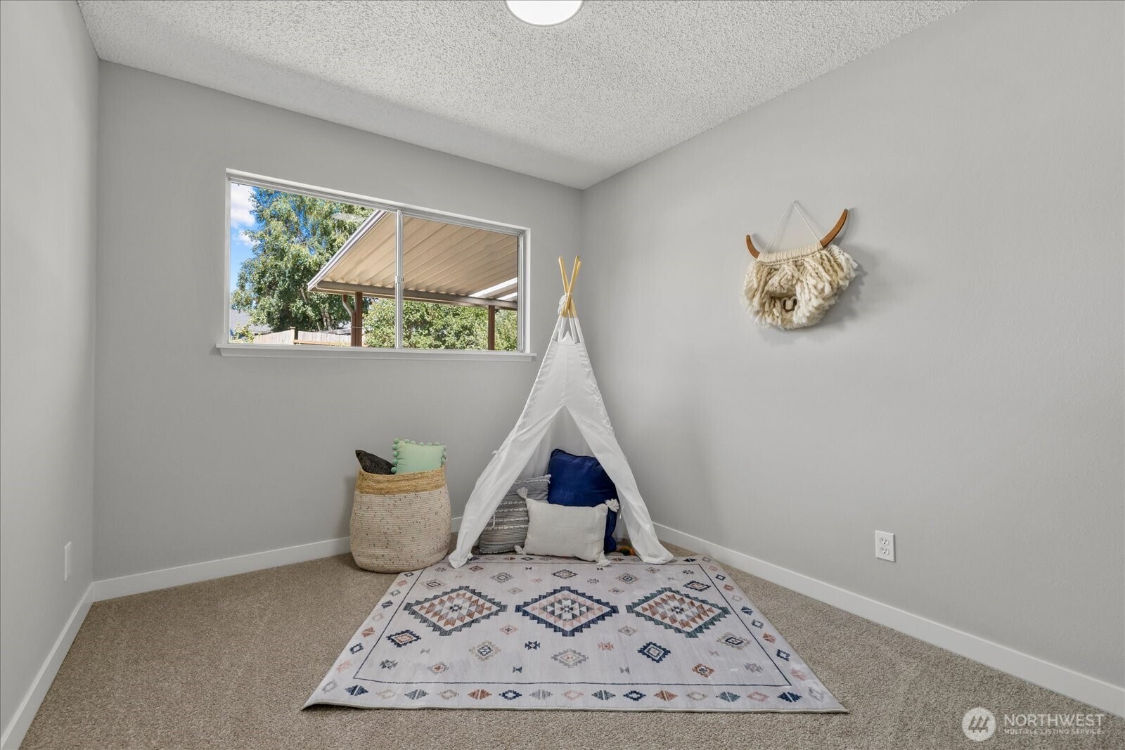 16531 120th Avenue Southeast Renton, WA 98058 - Photo 16 of 25 a room with a window and a potted plant