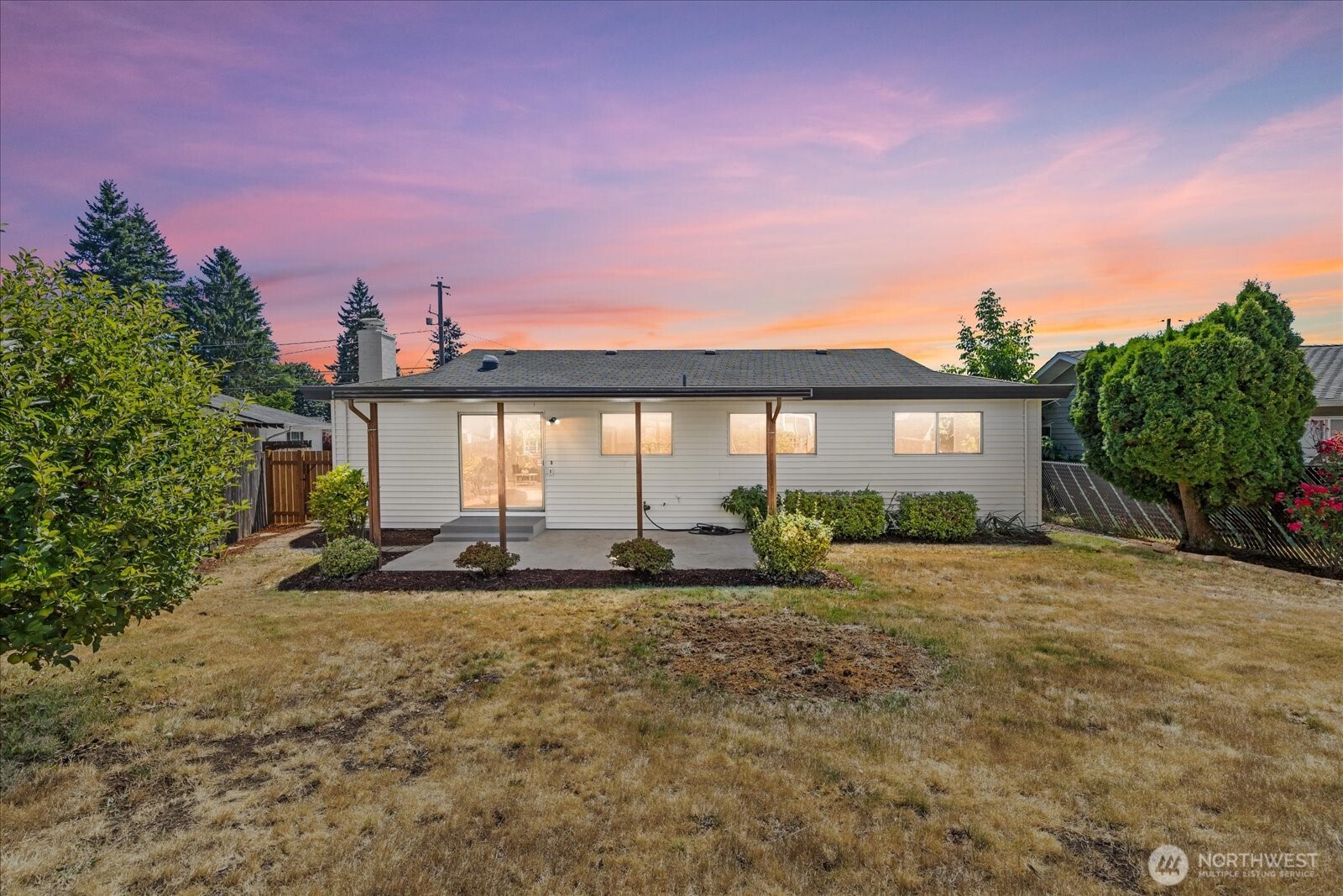 16531 120th Avenue Southeast Renton, WA 98058 - Photo 21 of 26 a front view of house with yard and trees in the background
